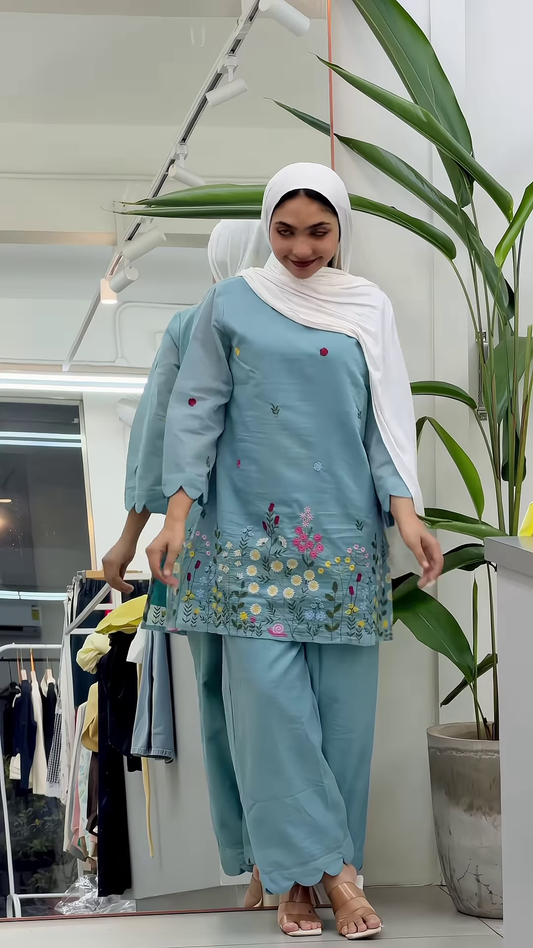 Sky Blue Knitted Vest and White Ruffled Blouse with Wide-Leg Denim