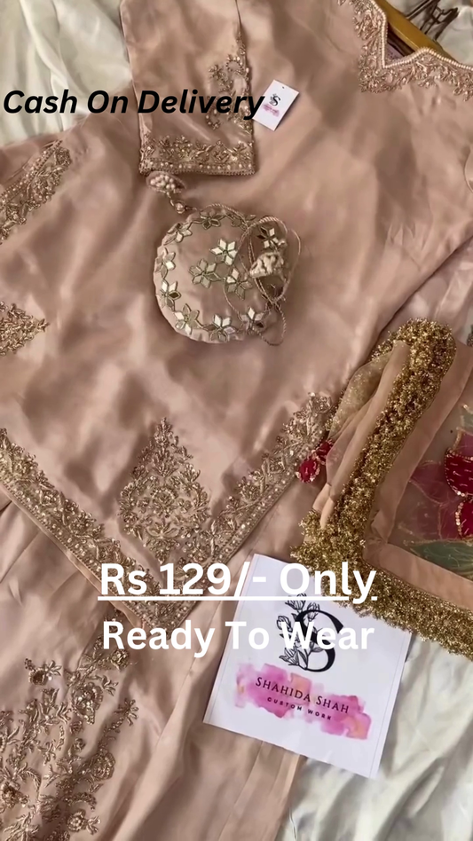 Rose Gold Splendor: Embroidered Silk Suit with Potli Bag