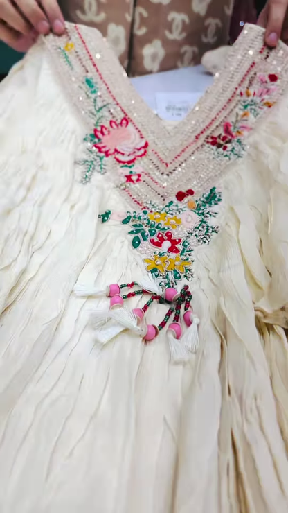 Close-Up of Ivory Crinkle-Fabric Tunic with Vibrant Floral Embroidery