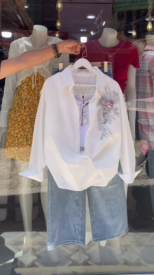 Embroidered White Shirt and Light-Wash Denim Ensemble